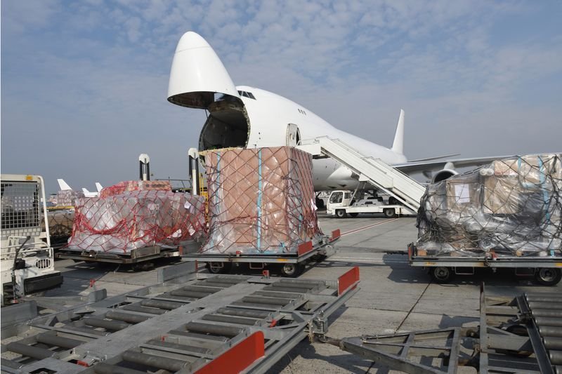 Air cargo pallets being loaded into a freighter aircraft
